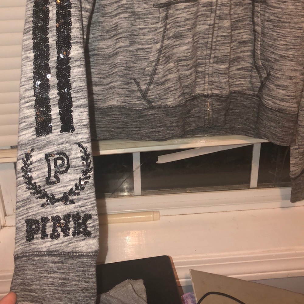 A pink victoria secret hoodie